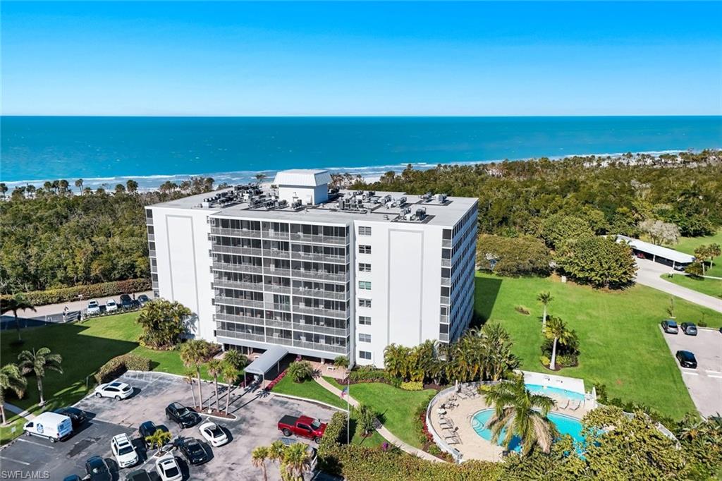 5 Bluebill Avenue, Unit 506 Naples, FL 34108 - Photo 24 of 25 a view of building with outdoor space