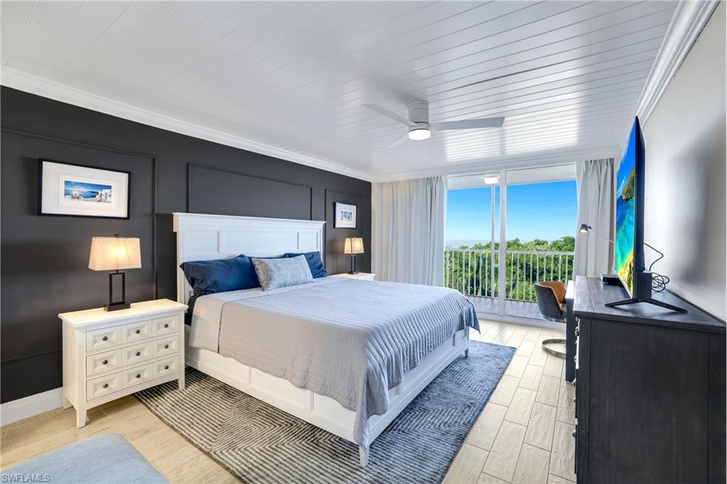 5 Bluebill Avenue, Unit 506 Naples, FL 34108 - Photo 10 of 25 a bedroom with bed and window