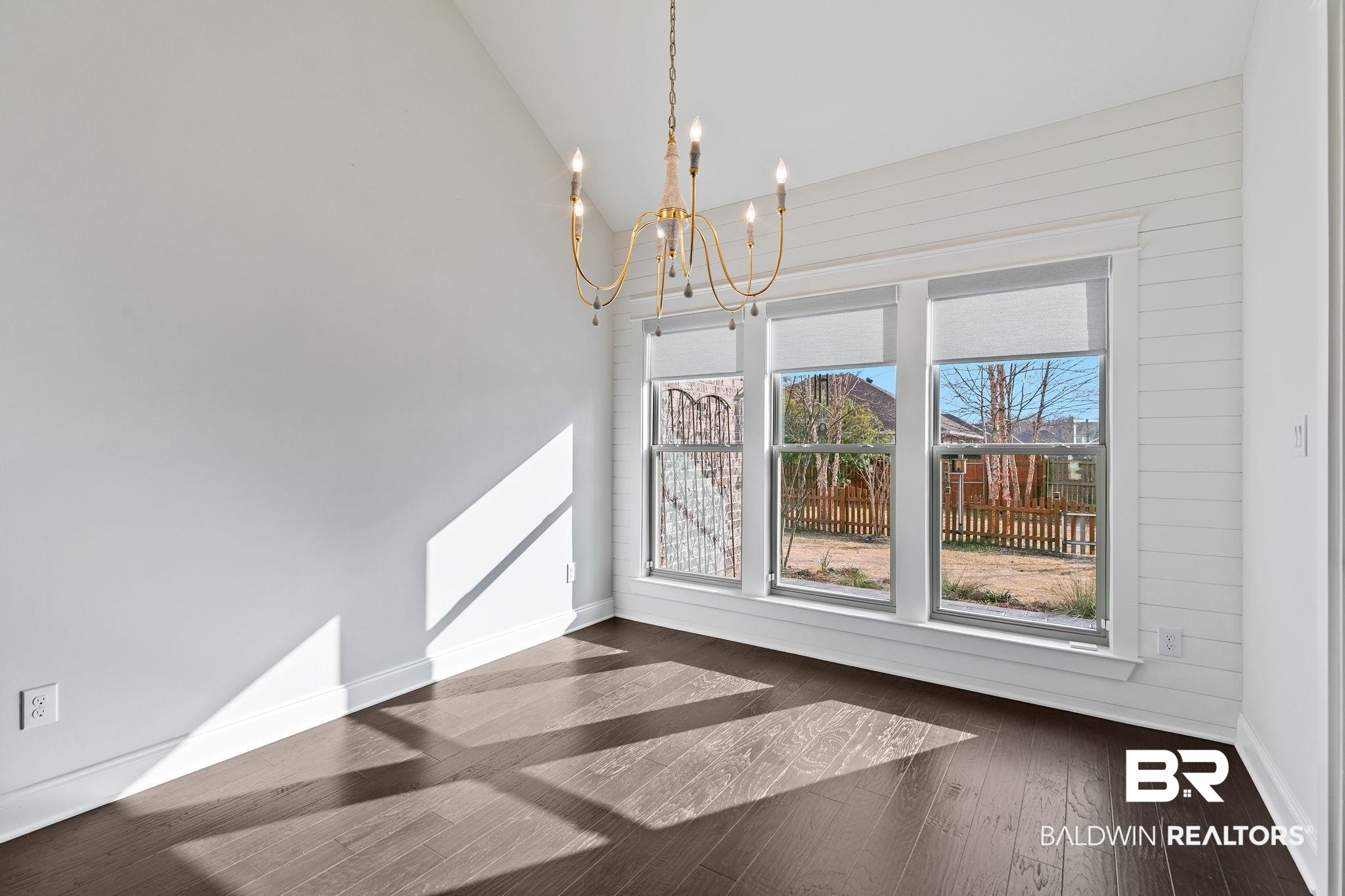31654 Canopy Loop Daphne, AL 36527 - Photo 23 of 64 Unfurnished dining area featuring dark wood-style floors, hanging lights, and lofted ceiling