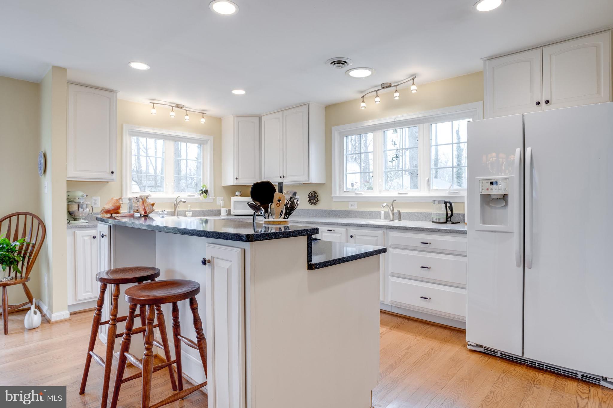 8901 Burke Road Burke, VA 22015 - Photo 11 of 63 a kitchen with white cabinets and sink