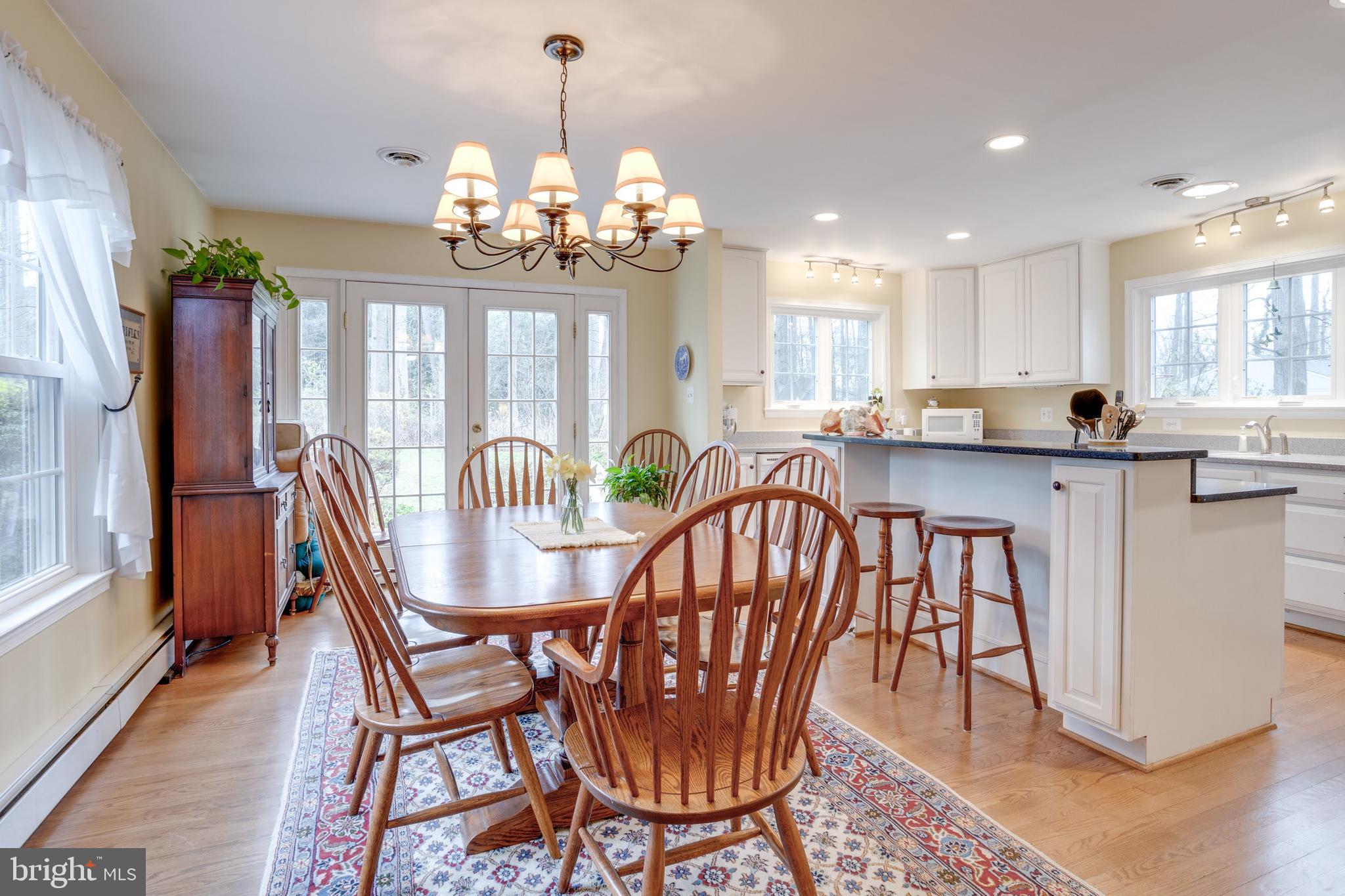 8901 Burke Road Burke, VA 22015 - Photo 12 of 63 a view of a dining room with furniture window and wooden floor
