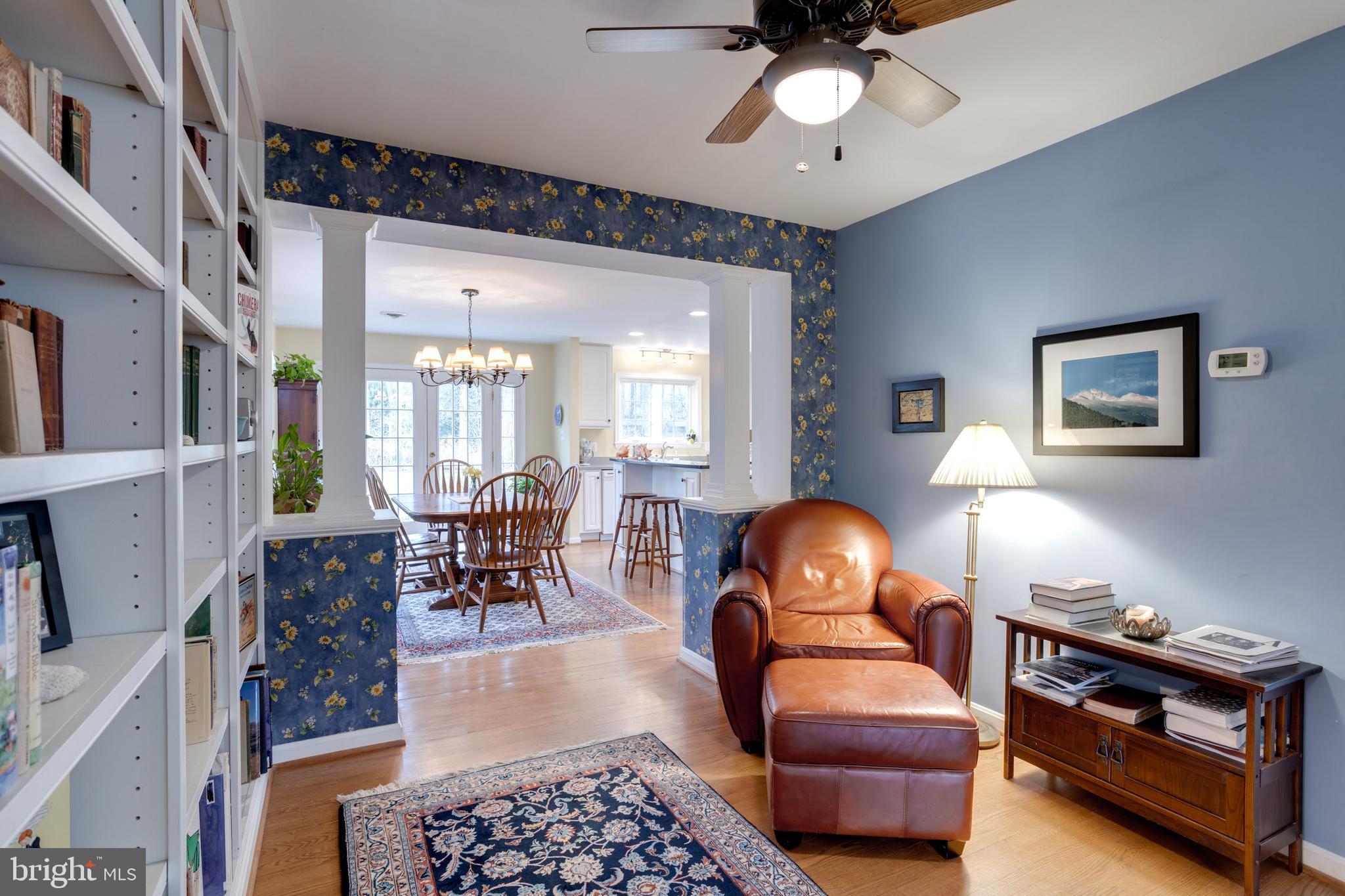 8901 Burke Road Burke, VA 22015 - Photo 18 of 63 a living room with furniture and a chandelier