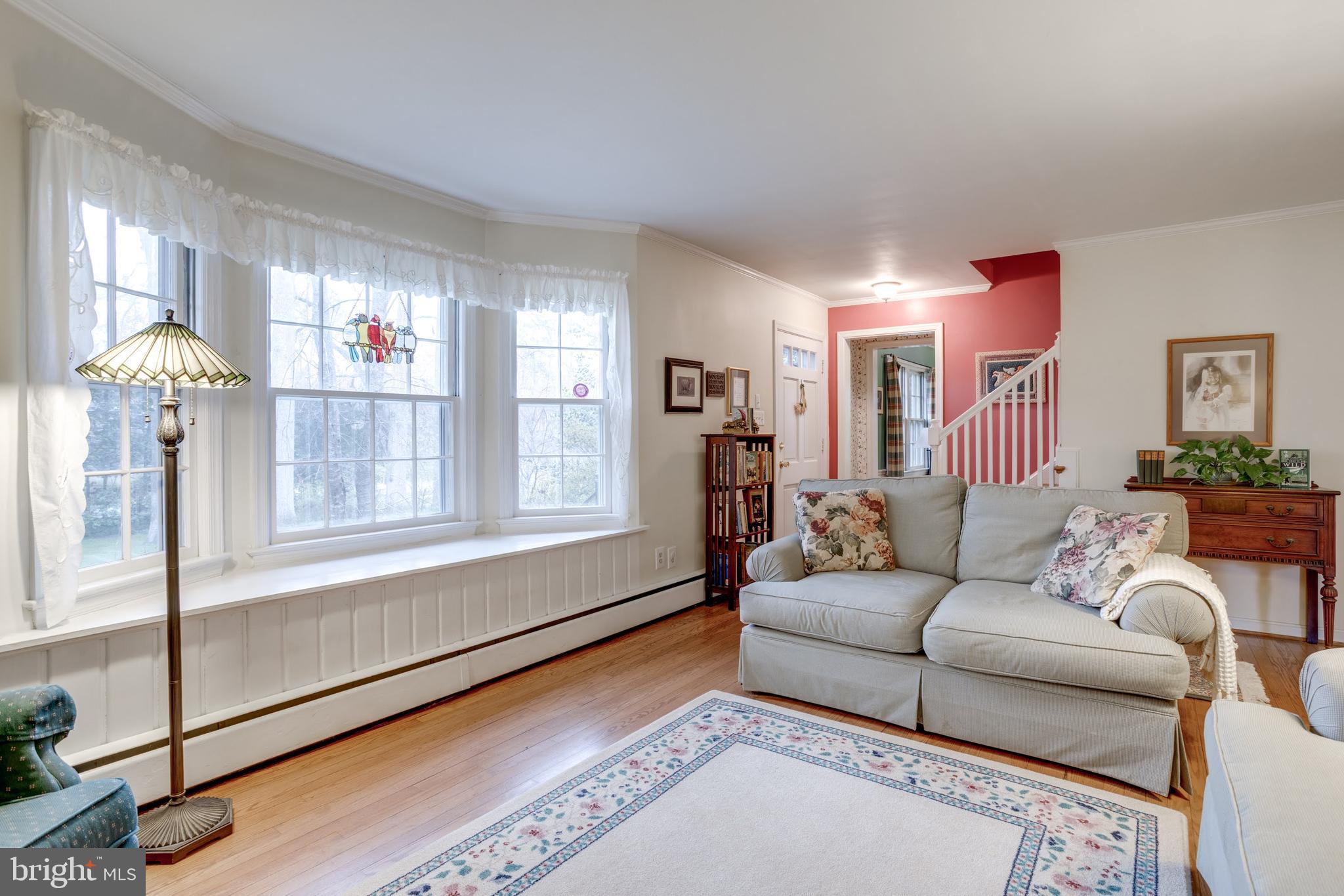 8901 Burke Road Burke, VA 22015 - Photo 23 of 63 a living room with furniture and a large window
