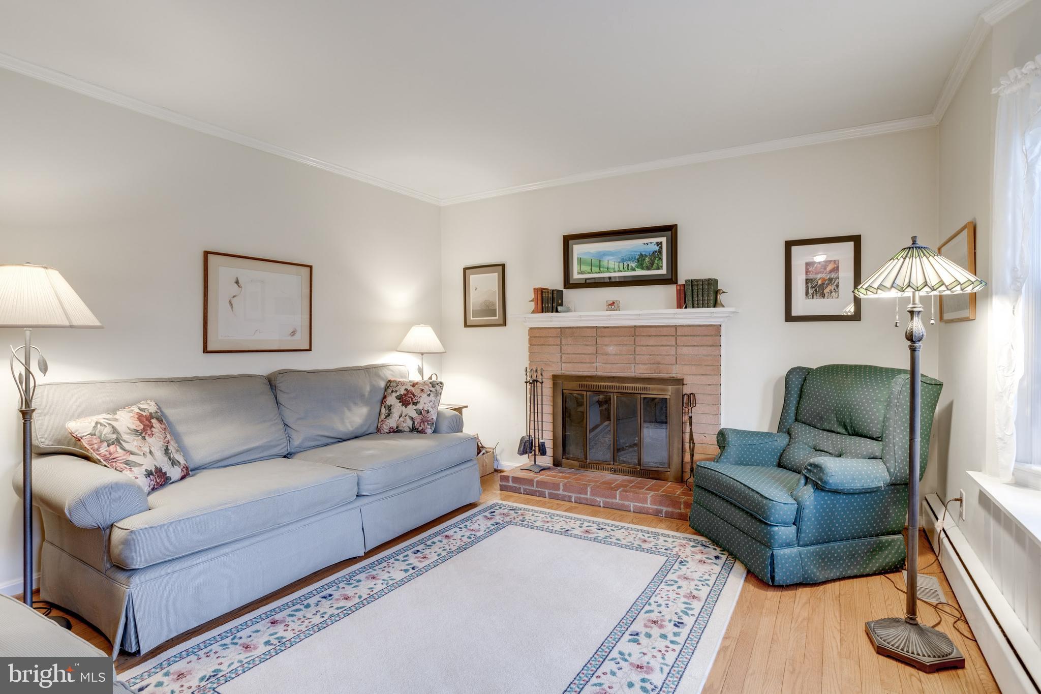 8901 Burke Road Burke, VA 22015 - Photo 27 of 63 a living room with furniture and a fireplace