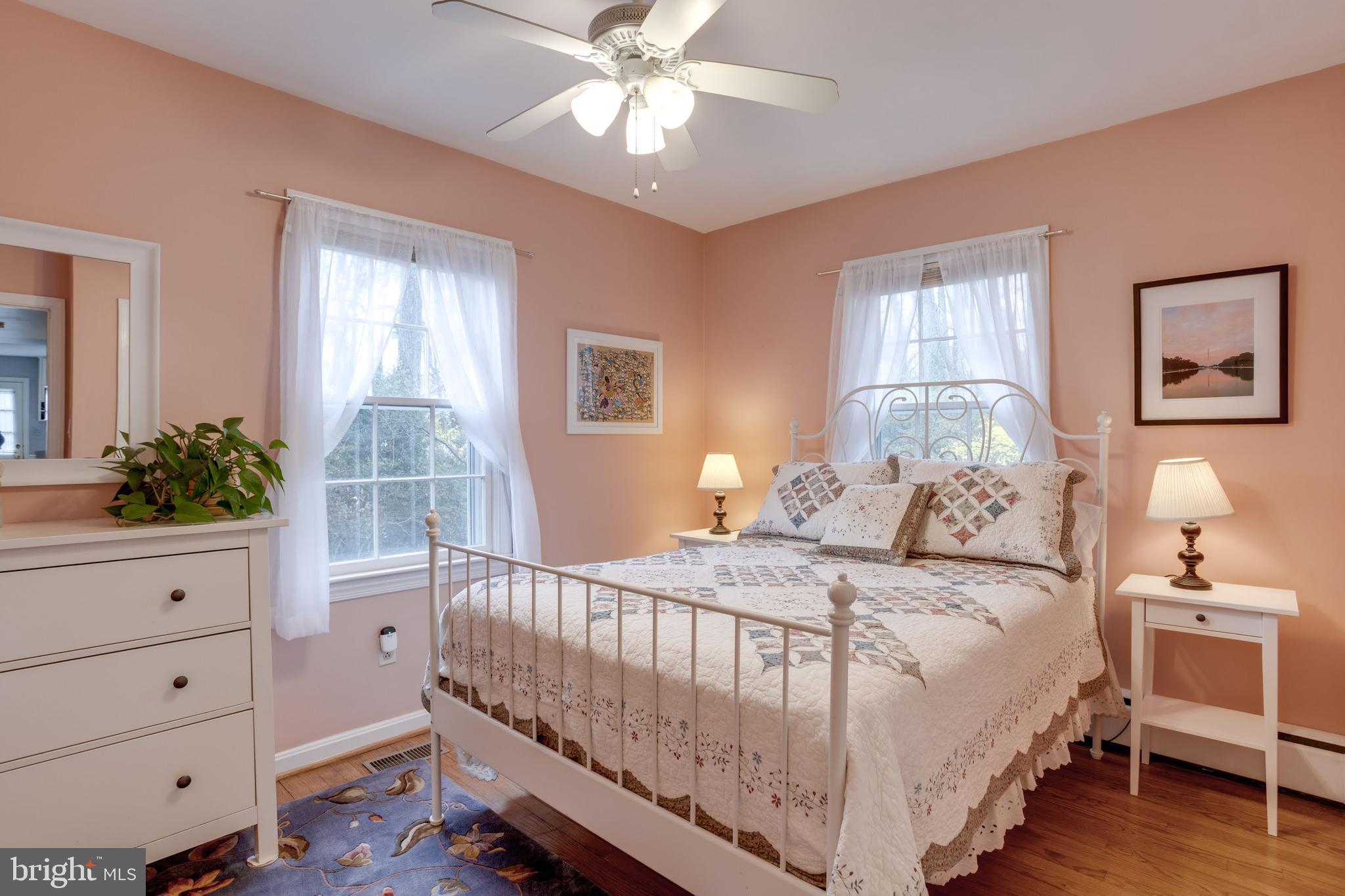 8901 Burke Road Burke, VA 22015 - Photo 30 of 63 a bedroom with a bed and a chandelier