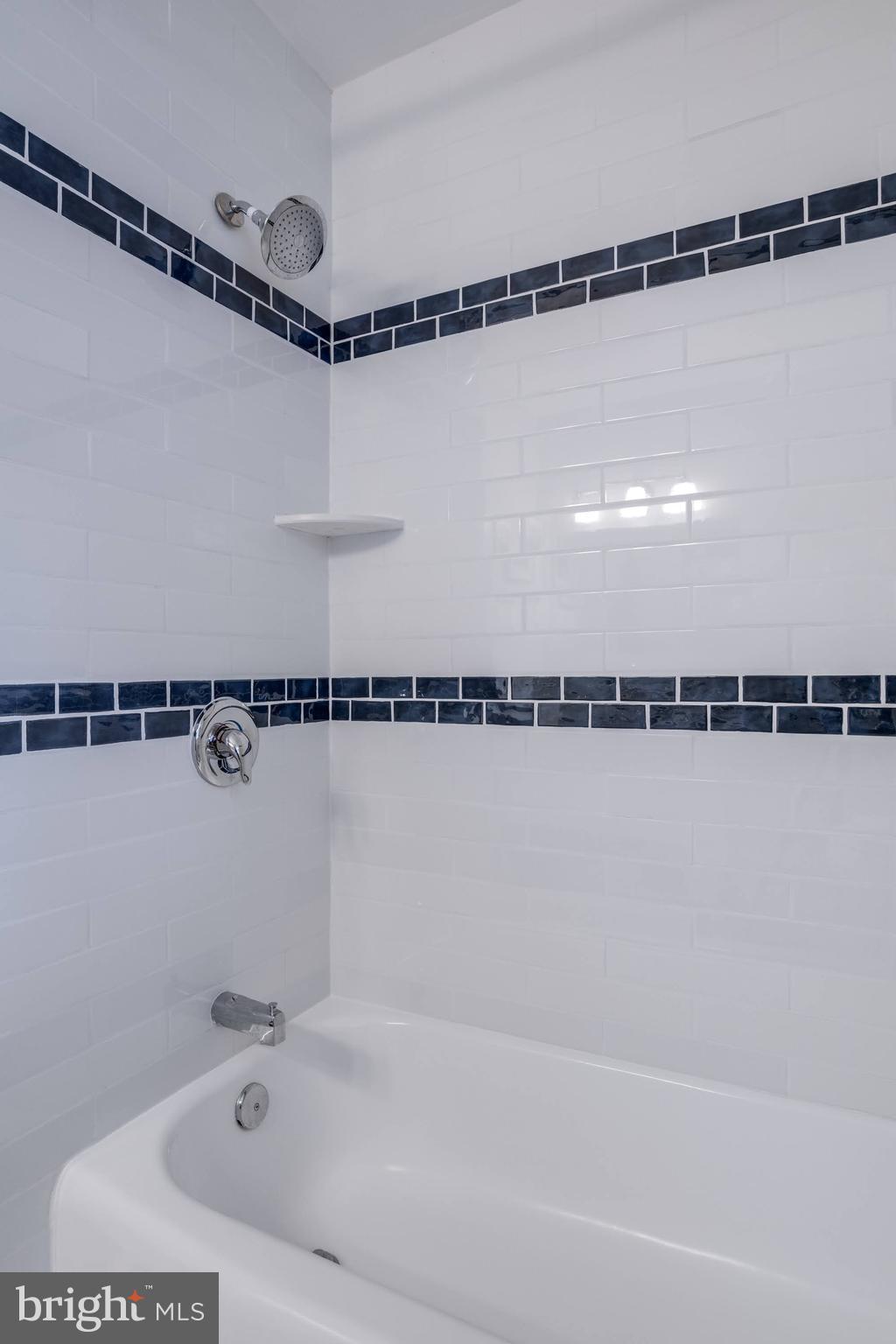 8901 Burke Road Burke, VA 22015 - Photo 32 of 63 a bathroom with a bathtub and a shower