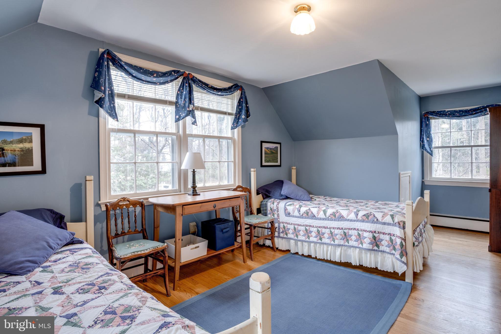 8901 Burke Road Burke, VA 22015 - Photo 34 of 63 a bedroom with a bed and a large window