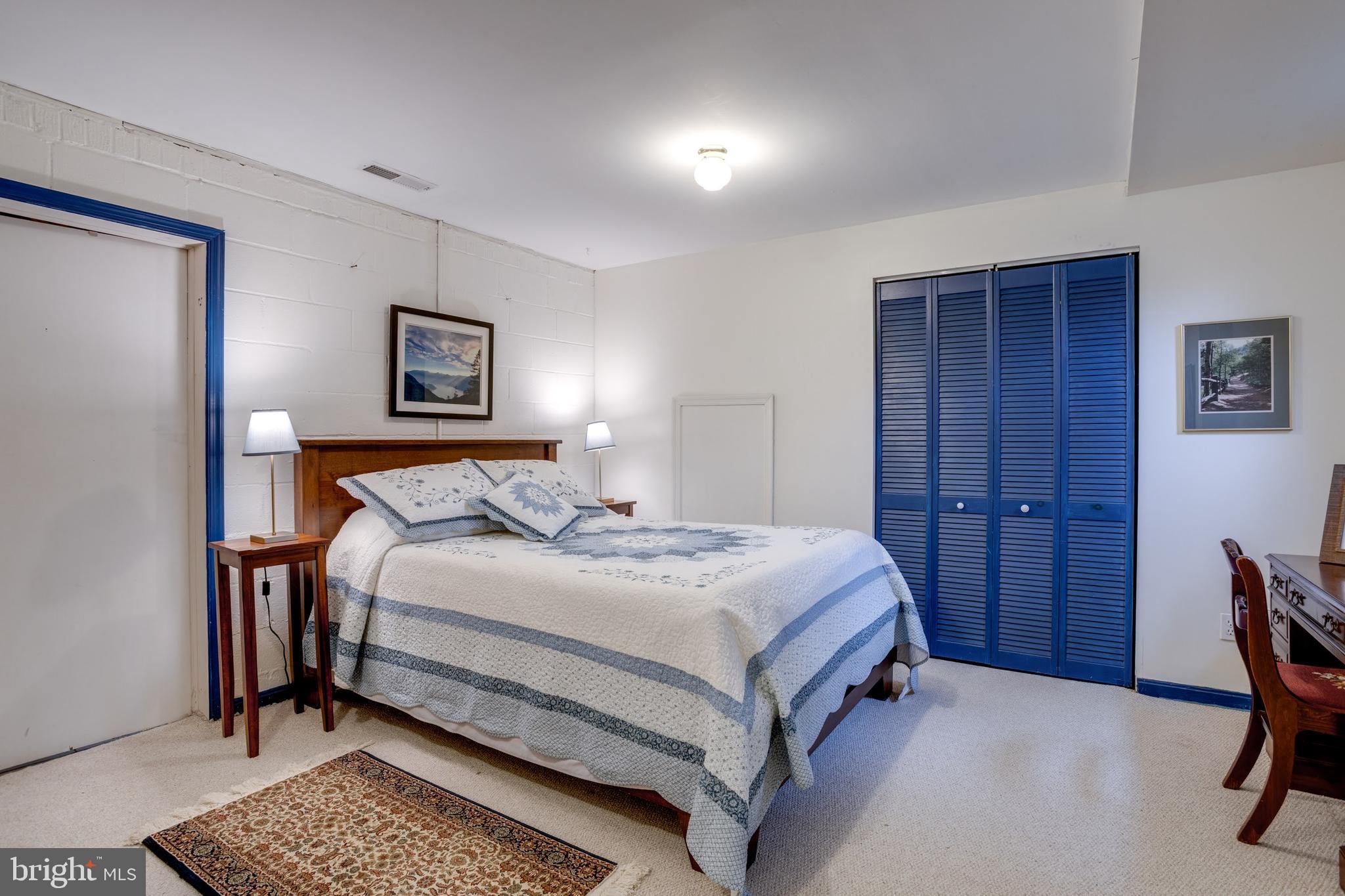 8901 Burke Road Burke, VA 22015 - Photo 41 of 63 a bedroom with a bed and a table in it