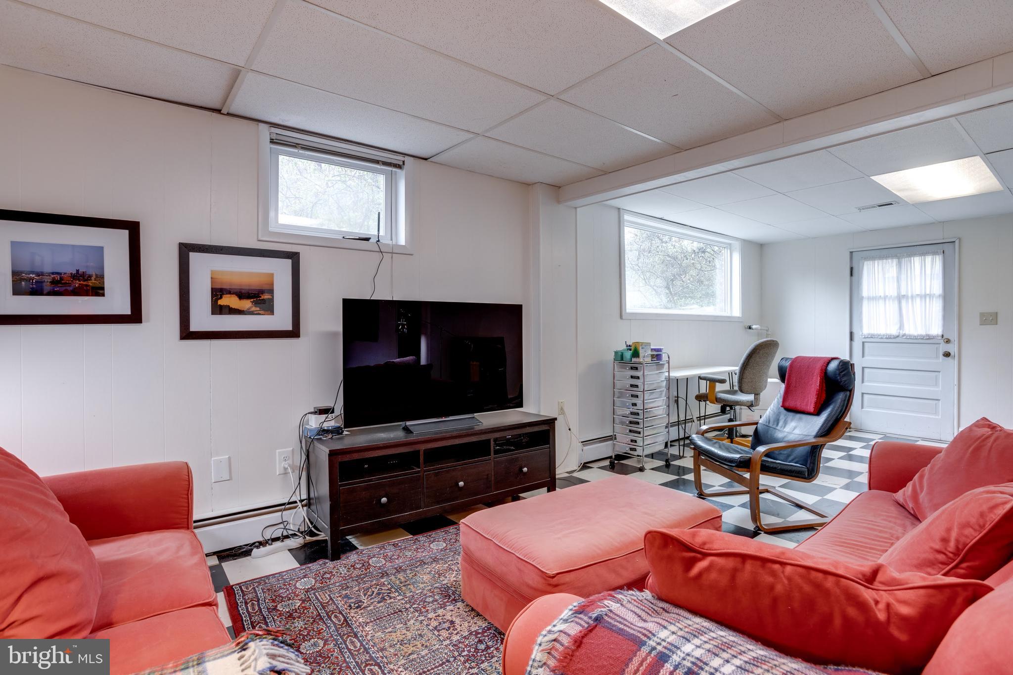 8901 Burke Road Burke, VA 22015 - Photo 42 of 63 a living room with furniture and a flat screen tv