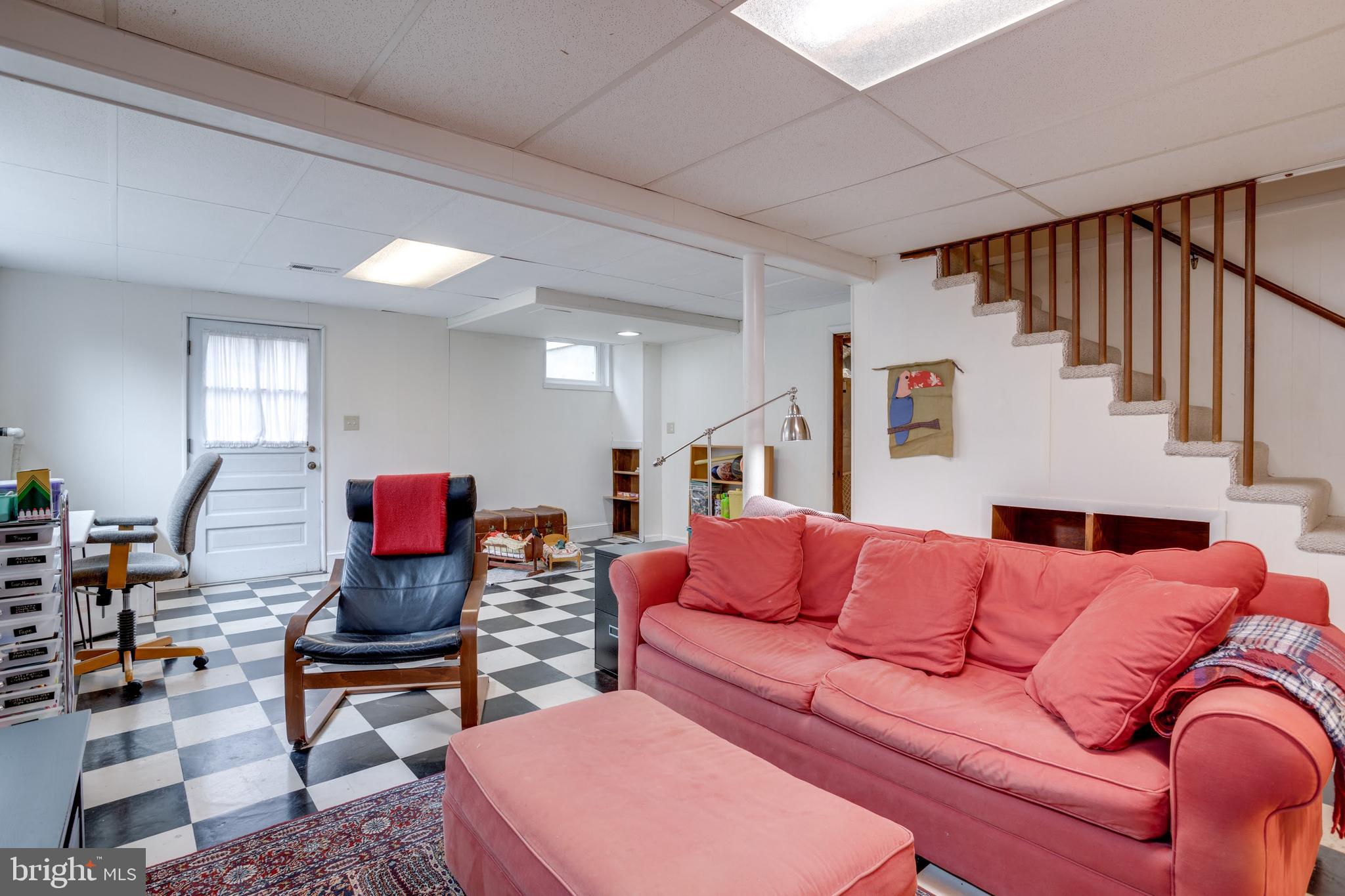 8901 Burke Road Burke, VA 22015 - Photo 43 of 63 a living room with furniture a rug and a window