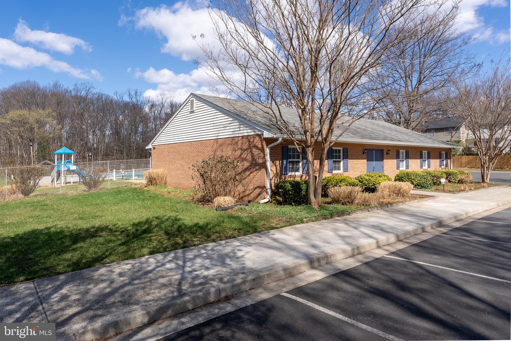 8901 Burke Road Burke, VA 22015 - Photo 55 of 63 a front view of a house with a yard