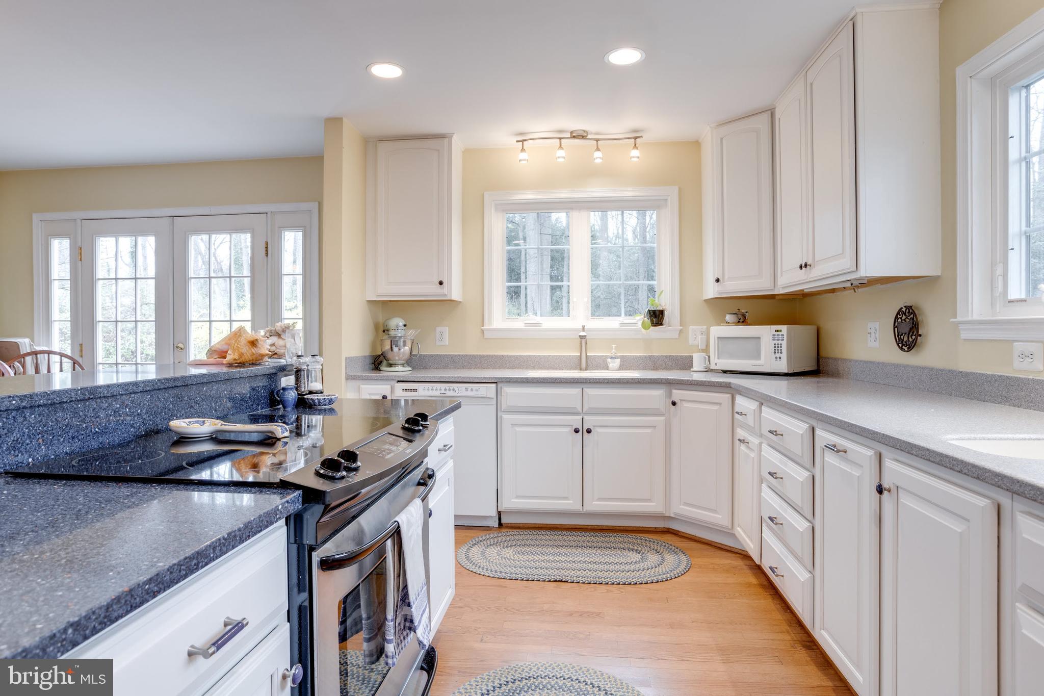 8901 Burke Road Burke, VA 22015 - Photo 9 of 63 a kitchen that has a sink and a stove in it