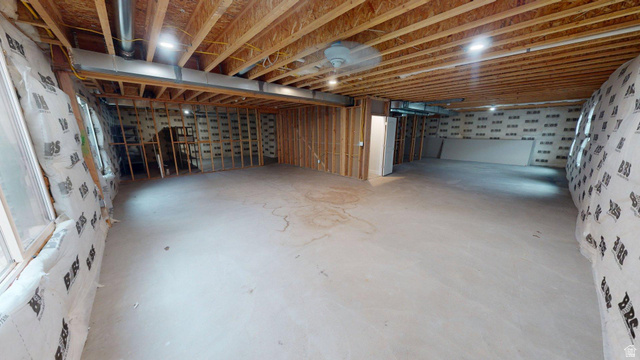 5502 North Valley View Road Lehi, UT 84048 - Photo 26 of 33 Unfinished basement featuring exposed wood joists, concrete flooring, framed interior walls, visible ductwork, and recessed lighting