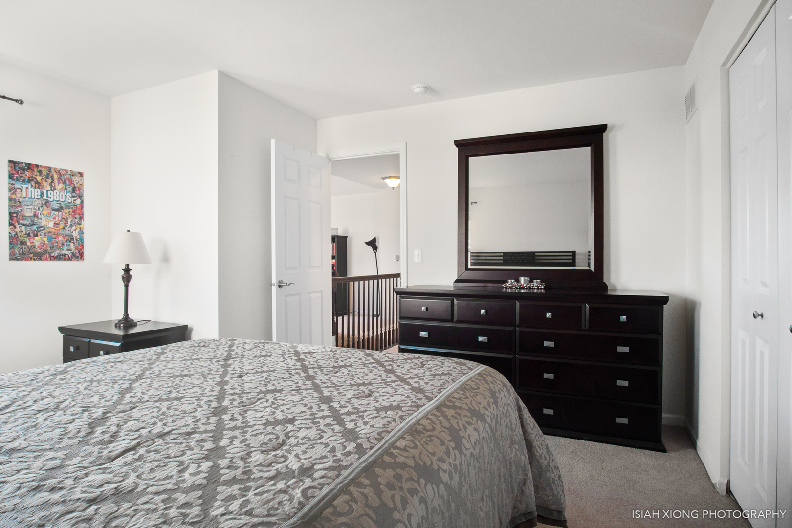 2908 Church Road Aurora, IL 60502 - Photo 19 of 26 a bedroom with a bed and a mirror on dresser