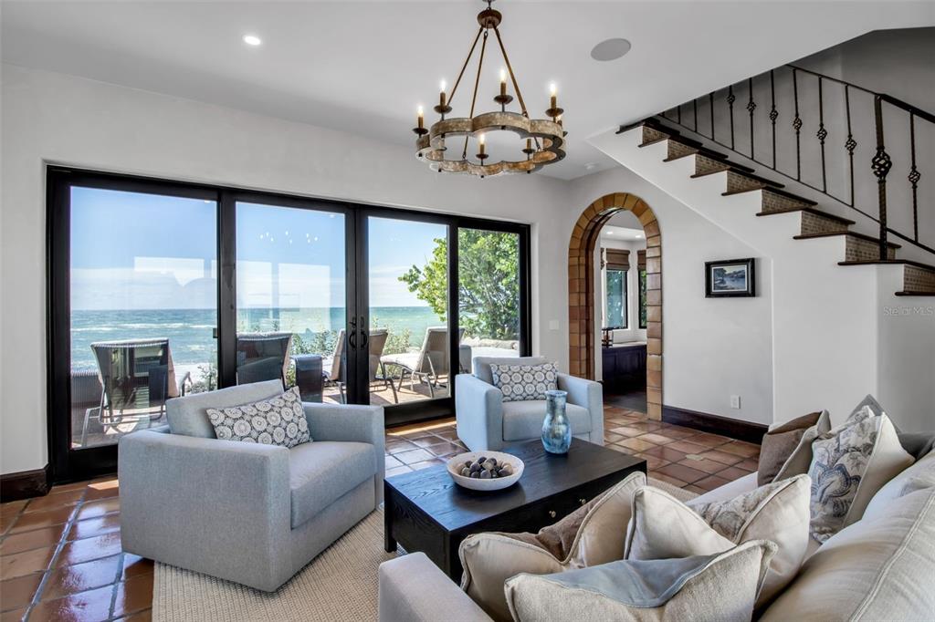 121 North Casey Key Road Osprey, FL 34229 - Photo 6 of 63 a living room with furniture and a large window