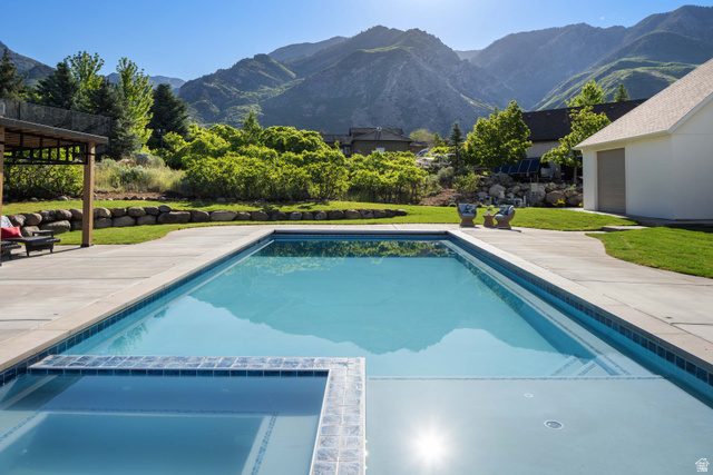 4292 Silver Sage Circle Alpine, UT 84004 - Photo 40 of 41 Rectangular in-ground pool with integrated spa, surrounded by expansive concrete decking
