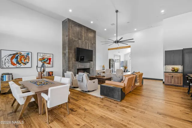 a living room with fireplace furniture and a flat screen tv