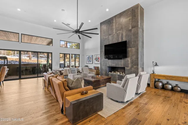 a living room with fireplace furniture and a flat screen tv