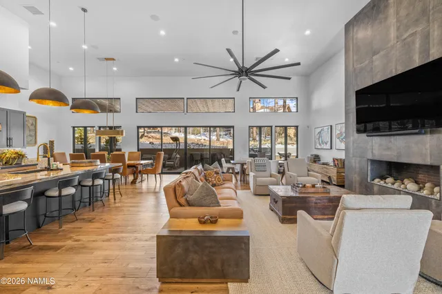 a living room with fireplace furniture and a flat screen tv