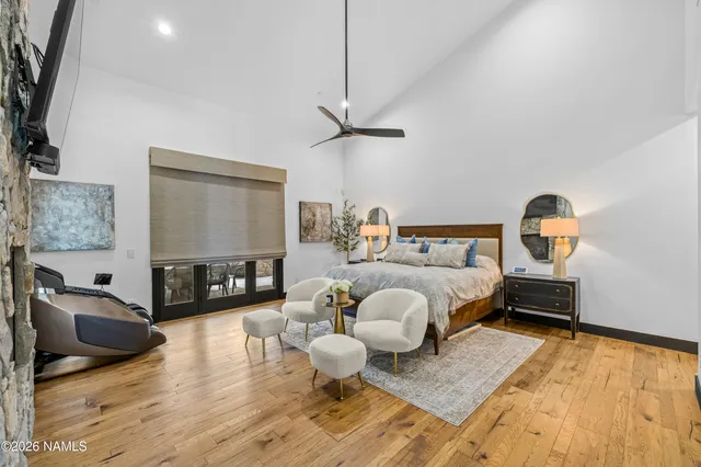 a bedroom with furniture and a mirror