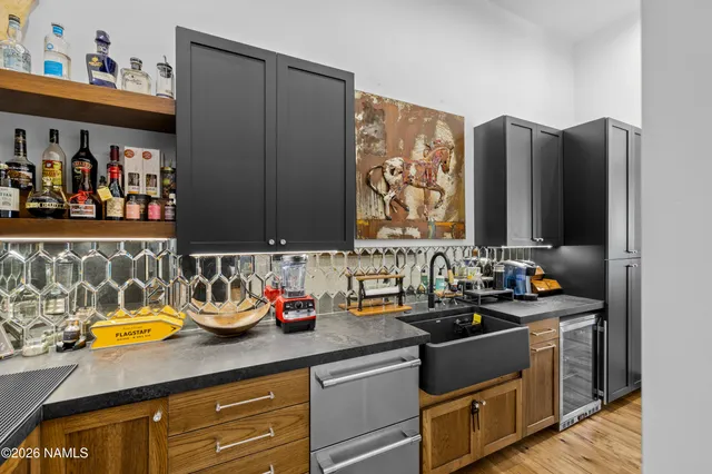 a kitchen with a sink and cabinets