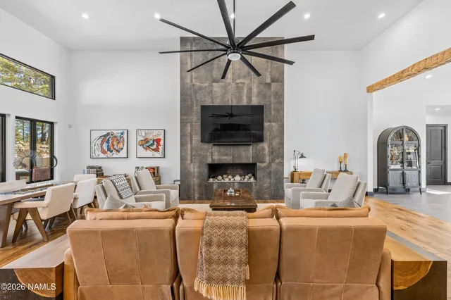 a living room with fireplace furniture and a fireplace