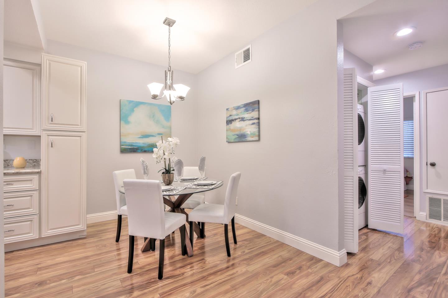 341 Shadow Run Drive San Jose, CA 95110 - Photo 12 of 25 a view of a dining room with furniture window and wooden floor