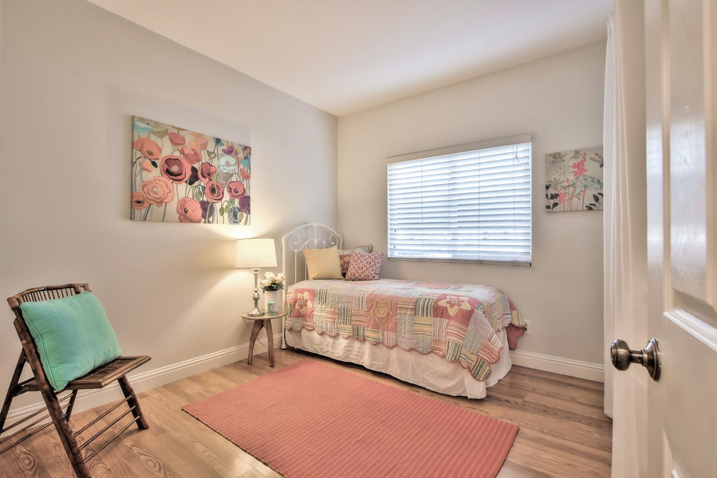 341 Shadow Run Drive San Jose, CA 95110 - Photo 19 of 25 a bedroom with a bed and a chair