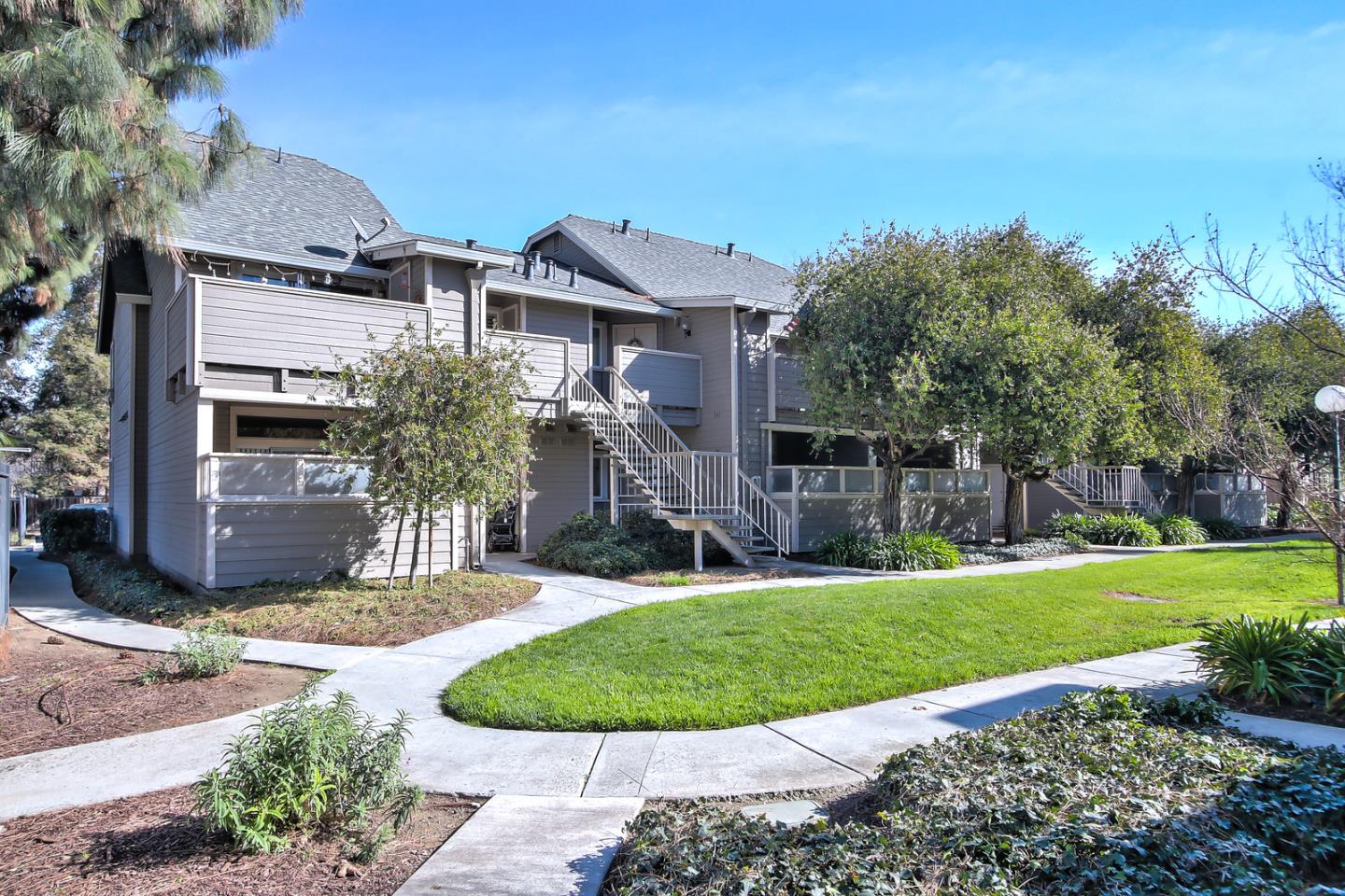 341 Shadow Run Drive San Jose, CA 95110 - Photo 2 of 25 a view of a house with a swimming pool and a yard