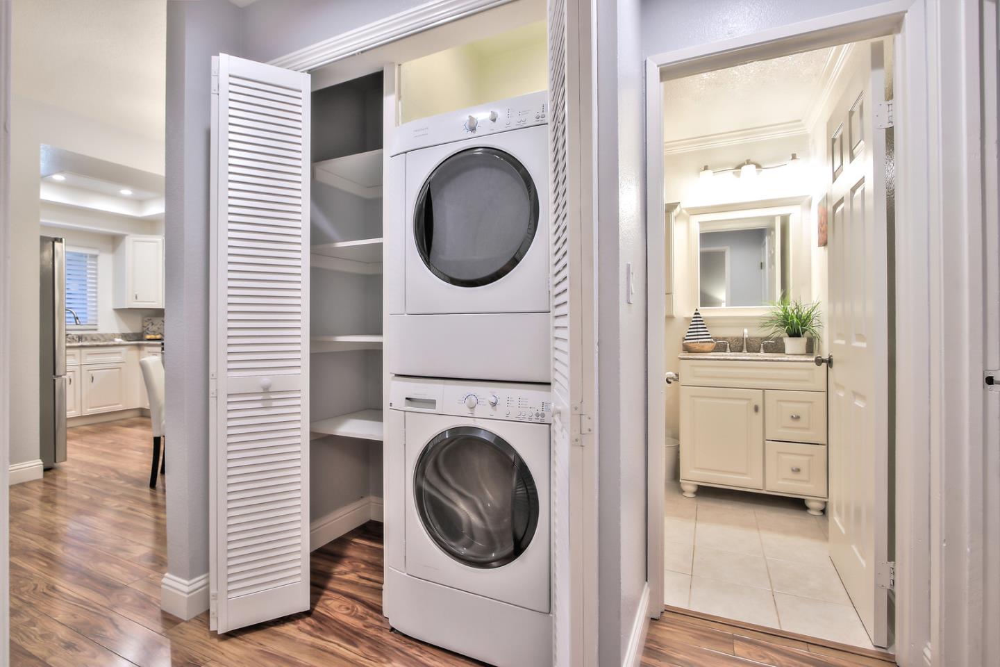341 Shadow Run Drive San Jose, CA 95110 - Photo 21 of 25 a view of a hallway with washer and dryer