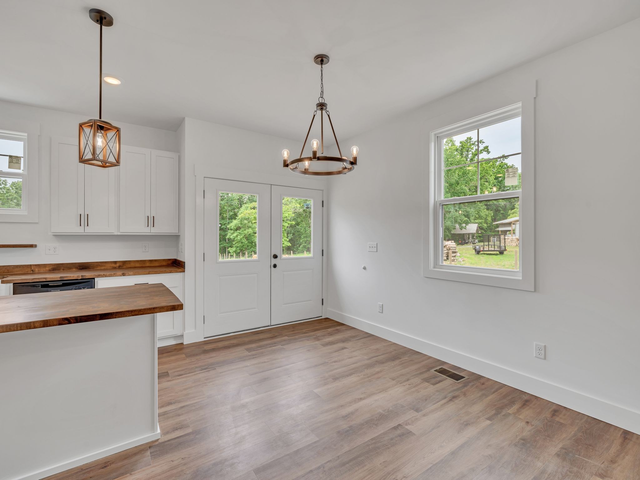5800 Sanders Road Lyles, TN 37098 - Photo 8 of 28 a kitchen that has a stove a window and wooden floor