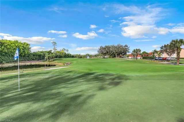 a view of a golf course with a lake view