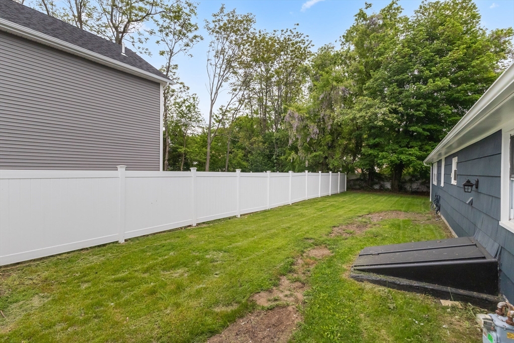 5 Phoenix Street Worcester, MA 01604 - Photo 10 of 32 a view of a backyard with a small cabin