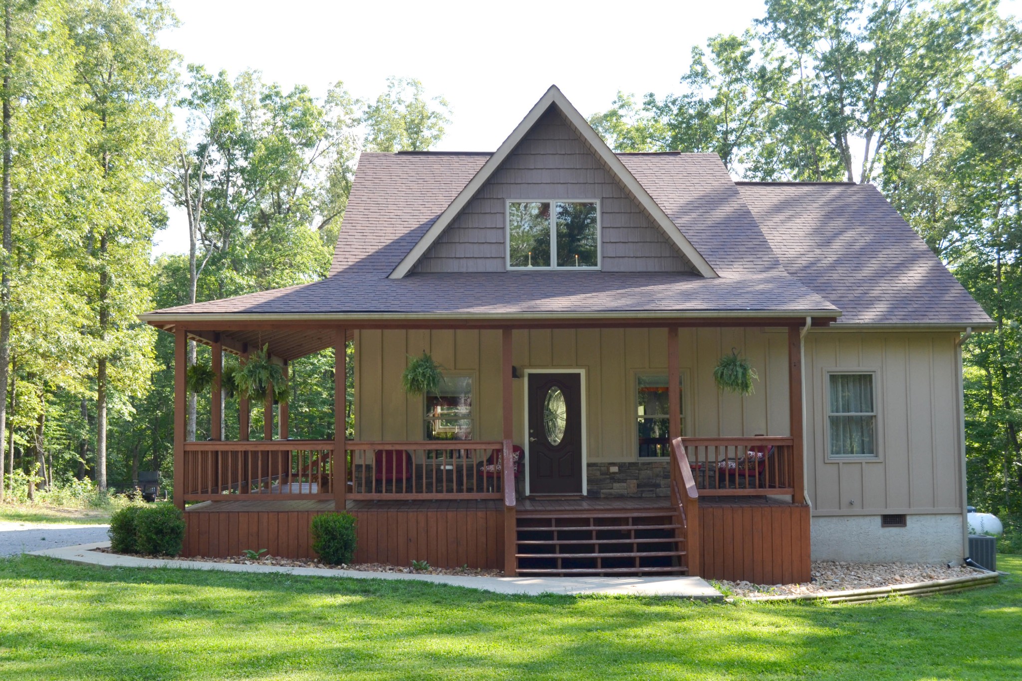 197 Rogers Road Crossville, TN 38571 - Photo 1 of 39 a view of a house with a yard potted plants and a large tree