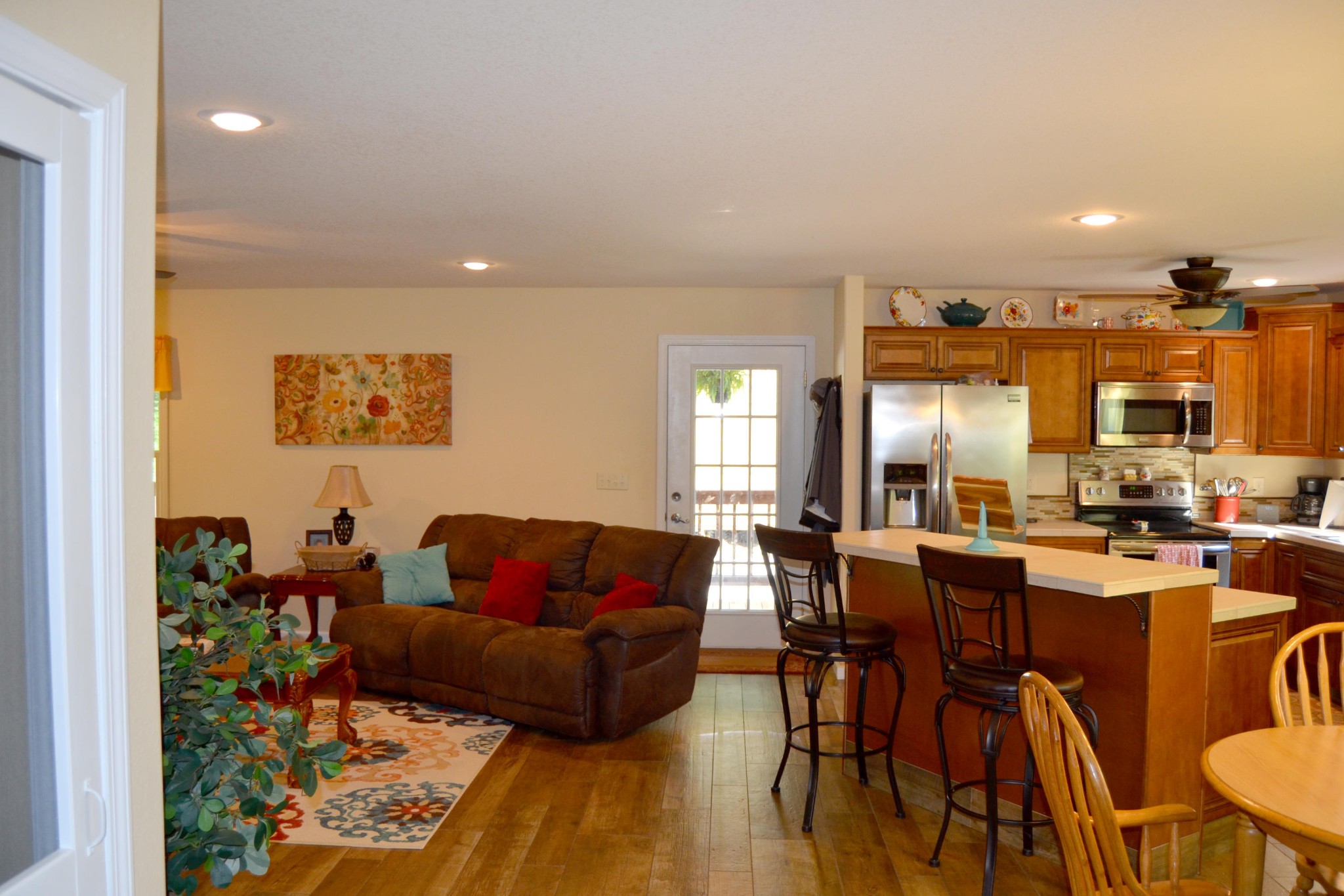 197 Rogers Road Crossville, TN 38571 - Photo 12 of 39 a living room with furniture kitchen view and a wooden floor