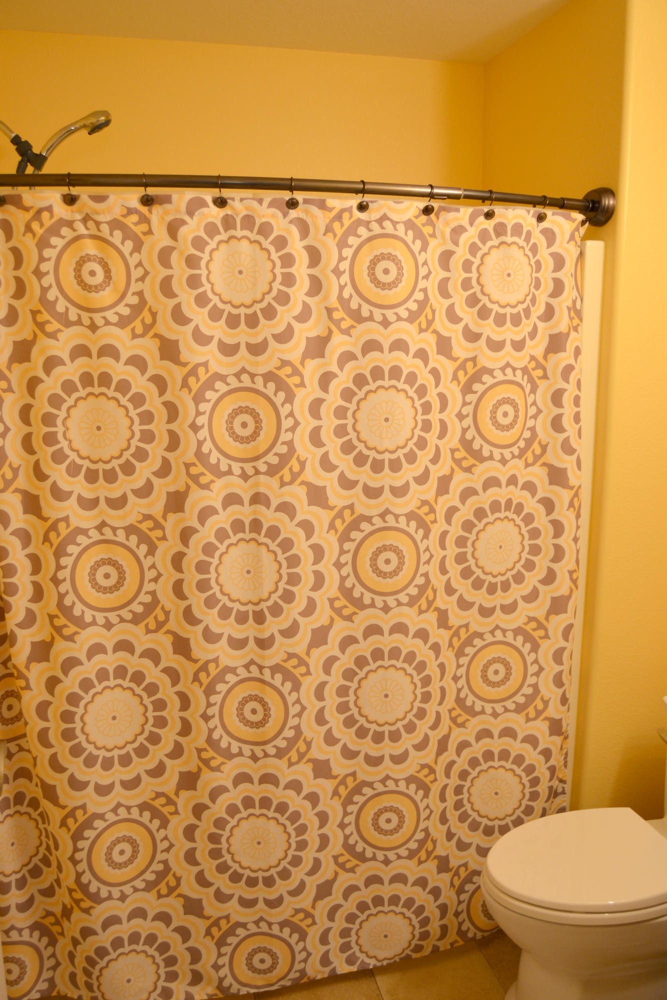 197 Rogers Road Crossville, TN 38571 - Photo 17 of 39 a white toilet sitting next to a shower curtain