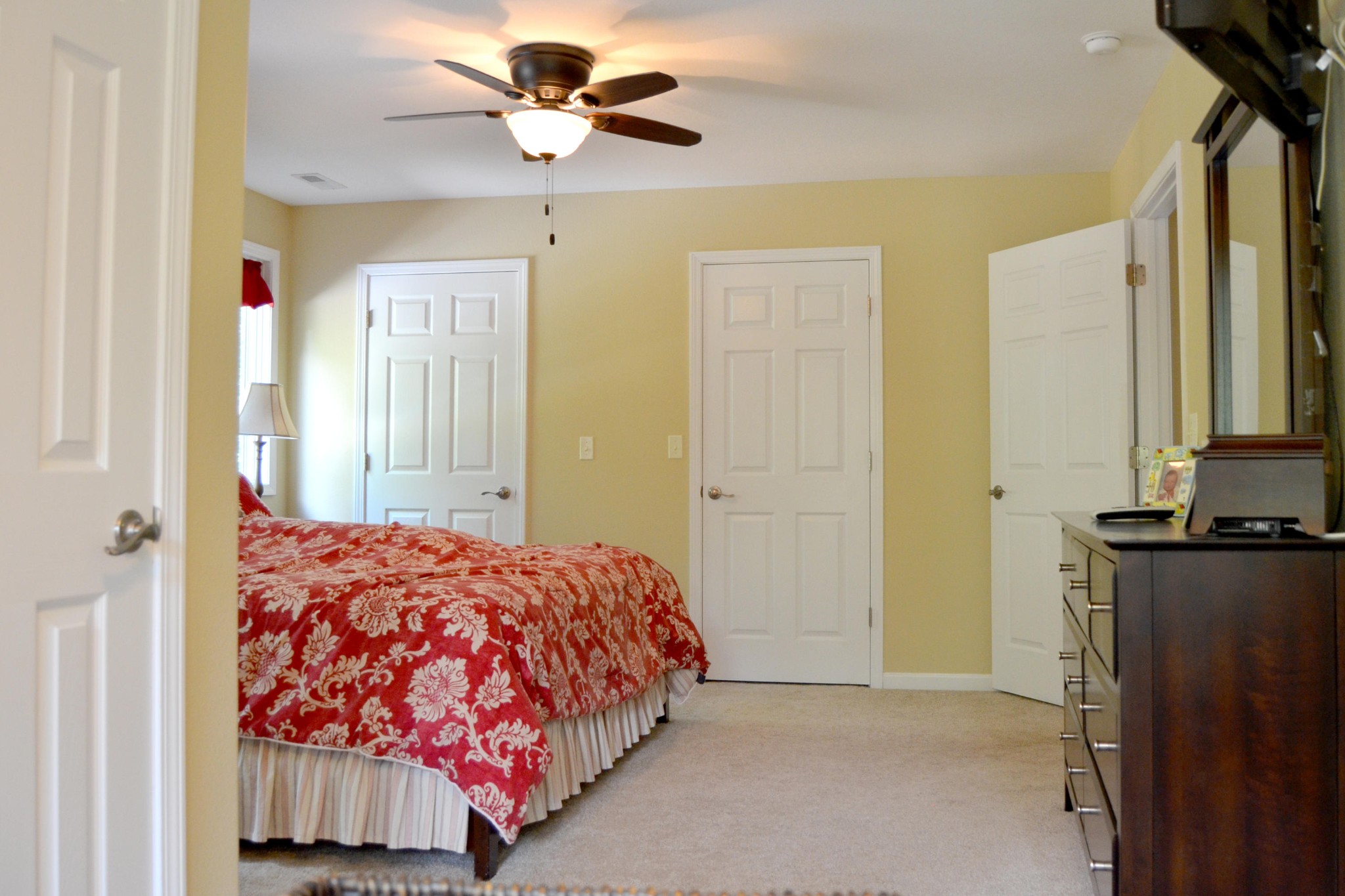 197 Rogers Road Crossville, TN 38571 - Photo 23 of 39 a bedroom with a bed and a chandelier