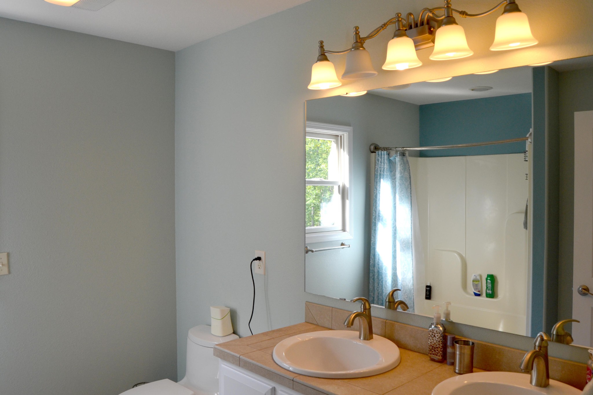 197 Rogers Road Crossville, TN 38571 - Photo 25 of 39 a bathroom with a granite countertop sink mirror vanity and toilet