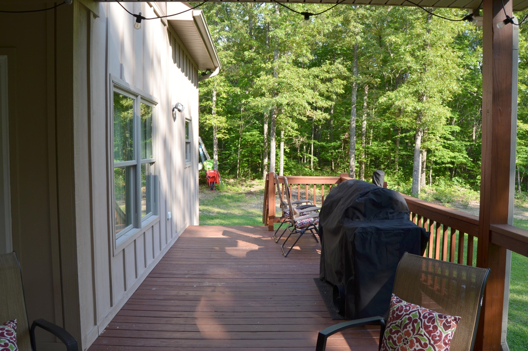 197 Rogers Road Crossville, TN 38571 - Photo 32 of 39 a view of a porch with a table chairs and a backyard