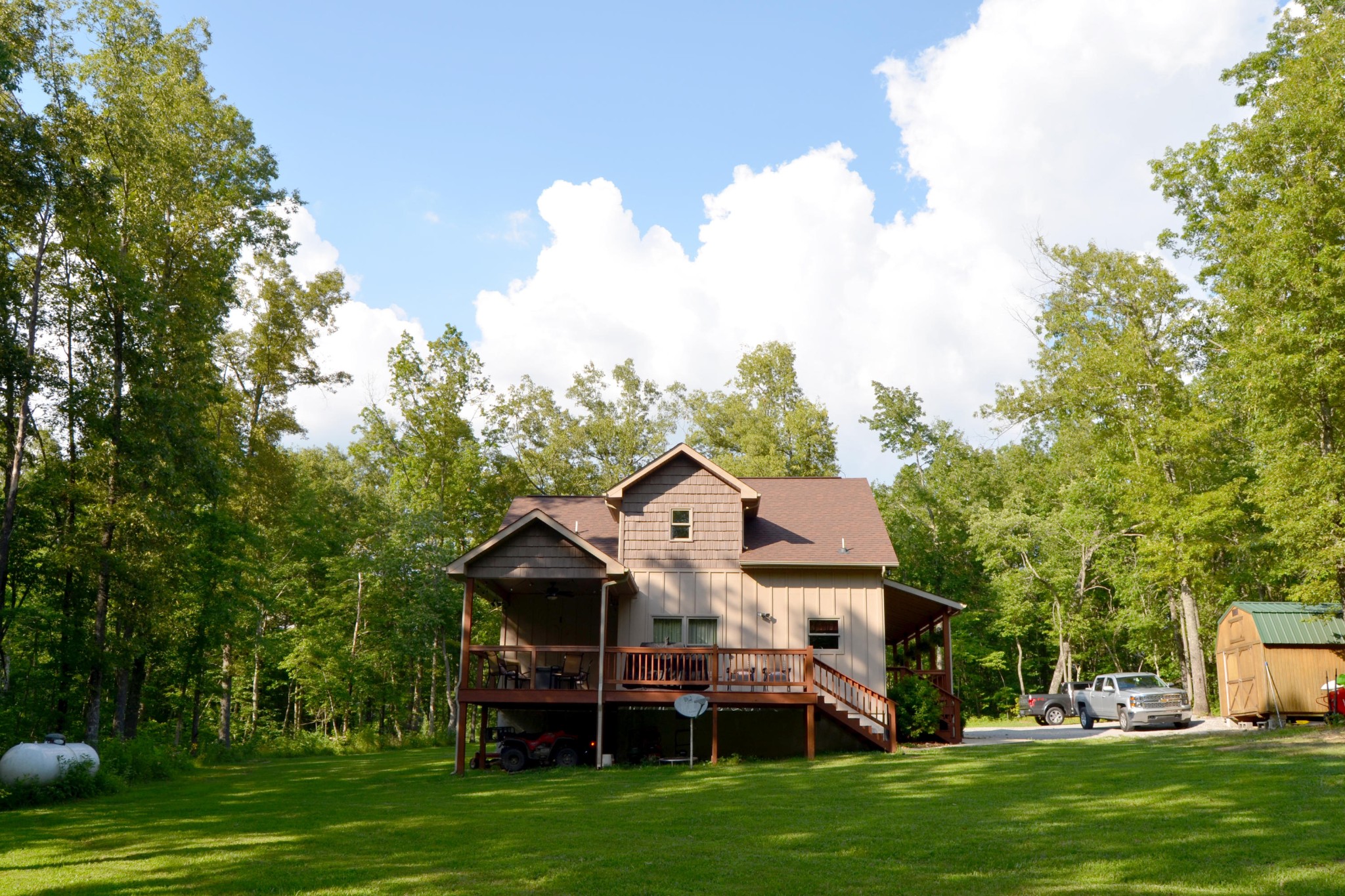 197 Rogers Road Crossville, TN 38571 - Photo 36 of 39 a view of a house with a big yard potted plants and large trees