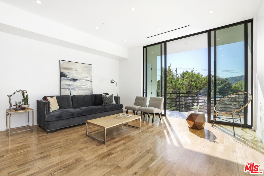 1411 West Roca Lane Los Angeles, CA 90041 - Photo 11 of 21 a living room with furniture and a large window