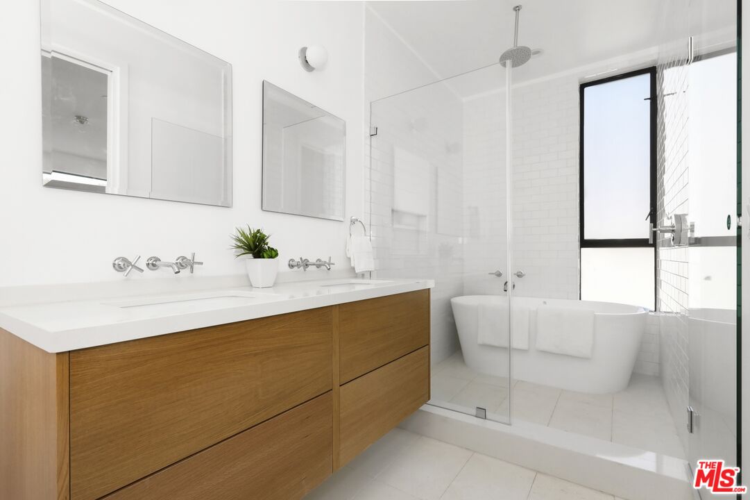 1411 West Roca Lane Los Angeles, CA 90041 - Photo 12 of 21 a bathroom with a sink and a mirror