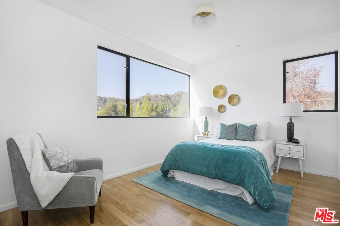 1411 West Roca Lane Los Angeles, CA 90041 - Photo 13 of 21 a bedroom with a bed and a painting on the wall
