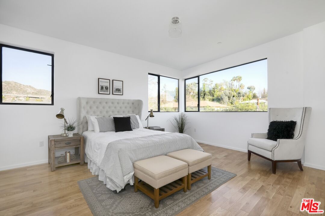1411 West Roca Lane Los Angeles, CA 90041 - Photo 14 of 21 a bedroom with a bed and a couch