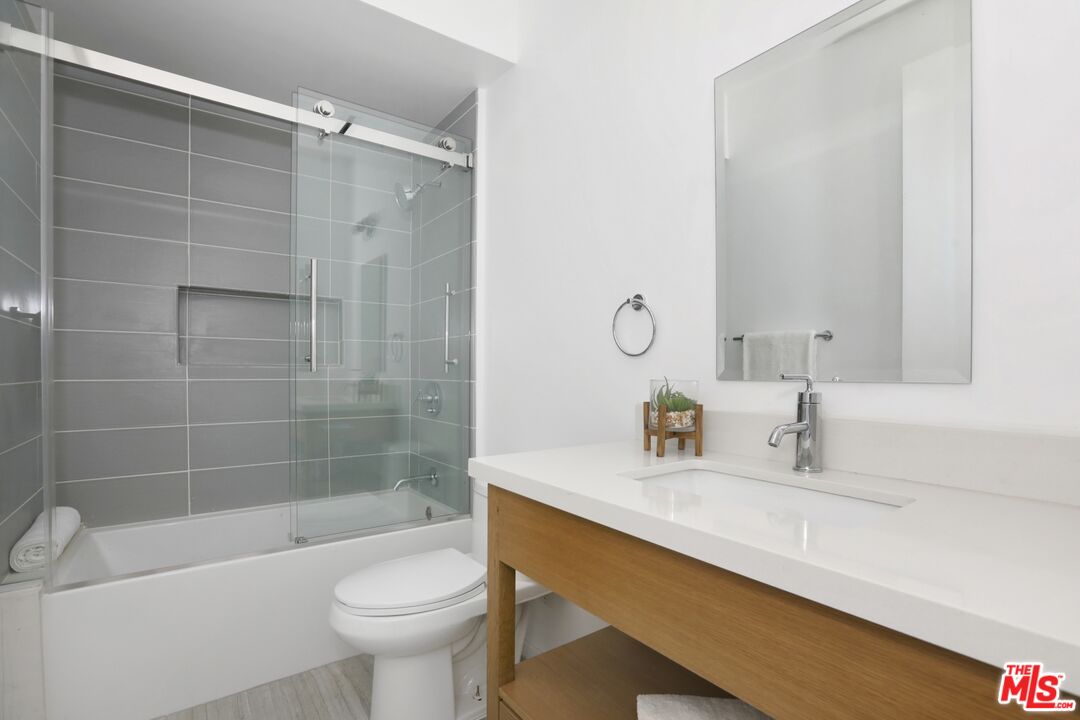 1411 West Roca Lane Los Angeles, CA 90041 - Photo 16 of 21 a bathroom with a sink a toilet and shower