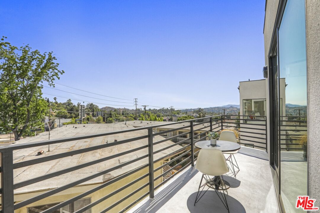 1411 West Roca Lane Los Angeles, CA 90041 - Photo 4 of 21 a view of a balcony with wooden floor and a bench