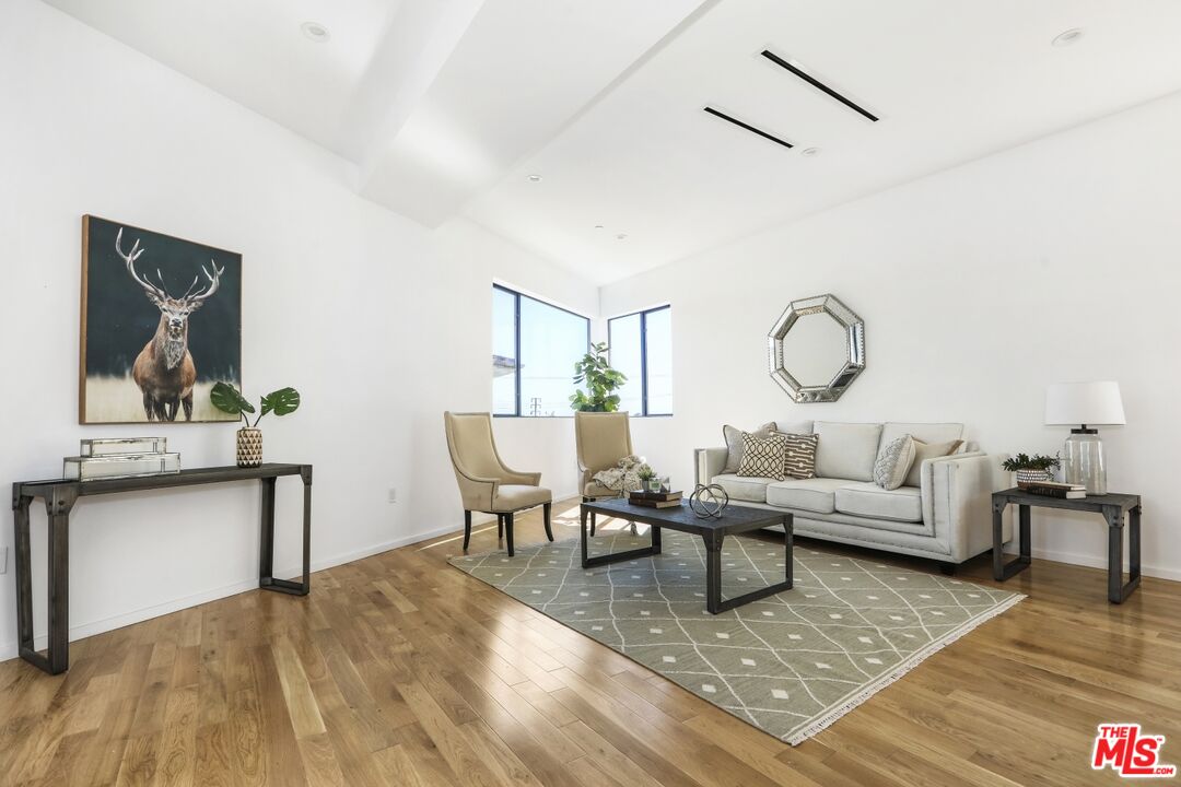 1411 West Roca Lane Los Angeles, CA 90041 - Photo 7 of 21 a living room with furniture and wooden floor
