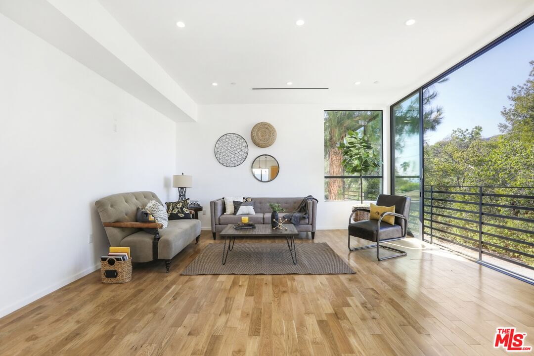 1411 West Roca Lane Los Angeles, CA 90041 - Photo 10 of 21 a living room with furniture and a large window