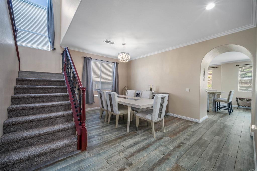 2781 Rambling Vista Road Chula Vista, CA 91915 - Photo 19 of 50 a view of a dining room with furniture and wooden floor
