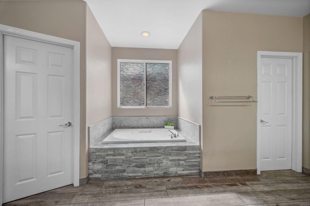 2781 Rambling Vista Road Chula Vista, CA 91915 - Photo 23 of 50 a bathroom with a tub shower and sink